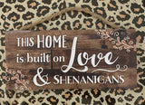 This home is built on love and shenanigans wall plaque